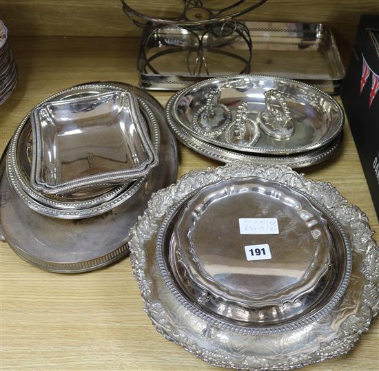 A quantity of mixed plated entree dishes and stands